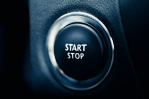 The start stop button of a car. Symbol for Begin and end, drive, engine and beginning. The start stop button of a car. Symbol for Begin and end, drive, engine and beginning.